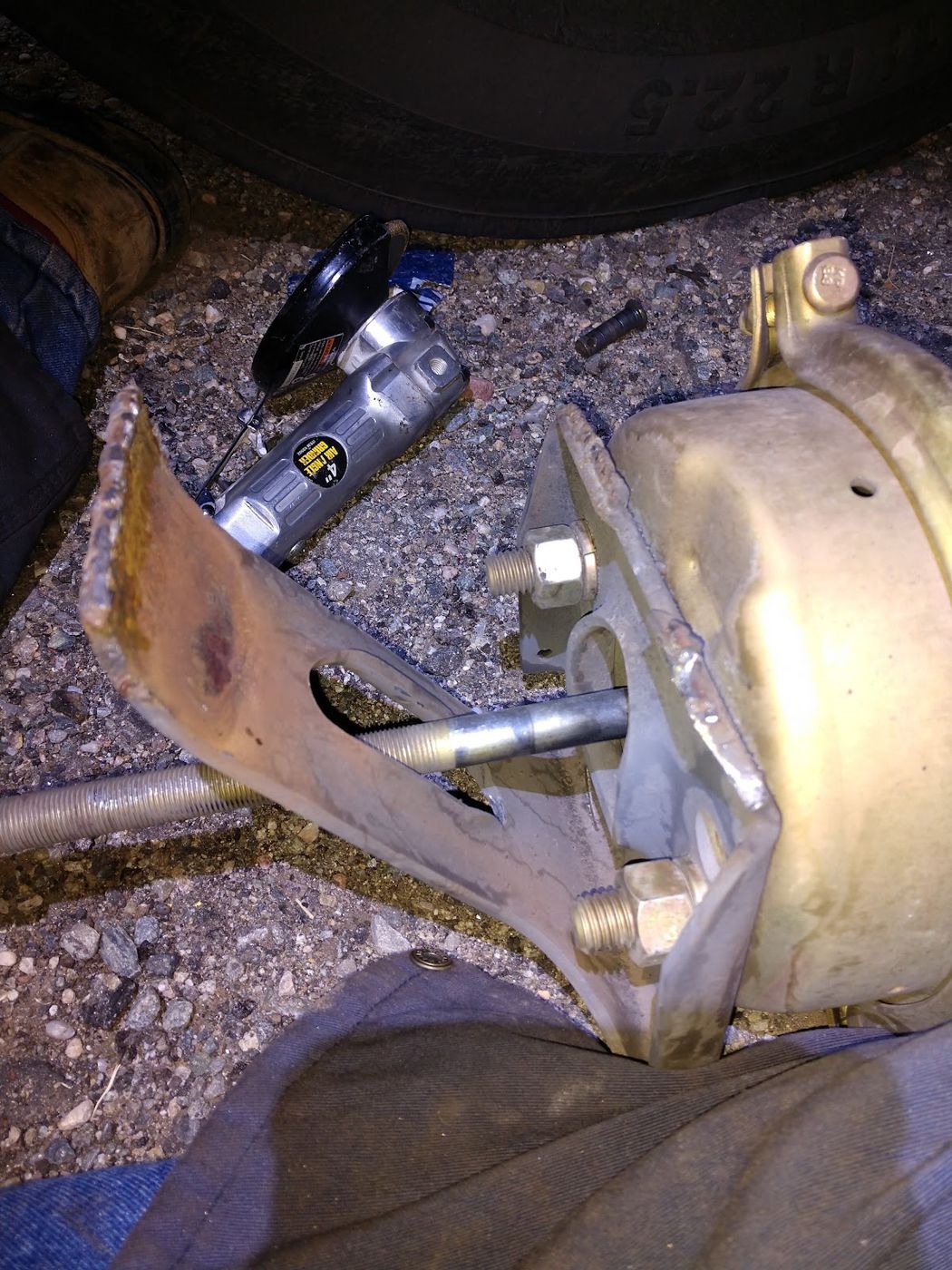 A brake chamber and linkage on a trailer axle